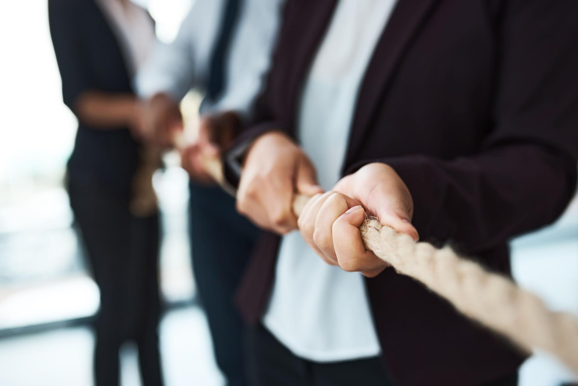 Cropped shot of unrecognizable businesspeople pulling on a rope