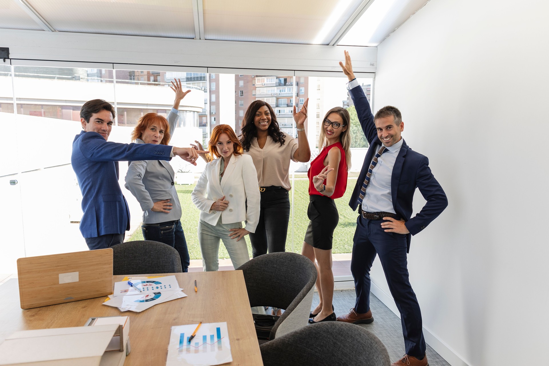 Business team celebrating success in modern office