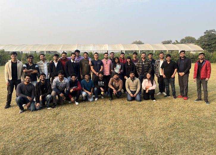 Corporate team building group photo on lawn organised by Gotag