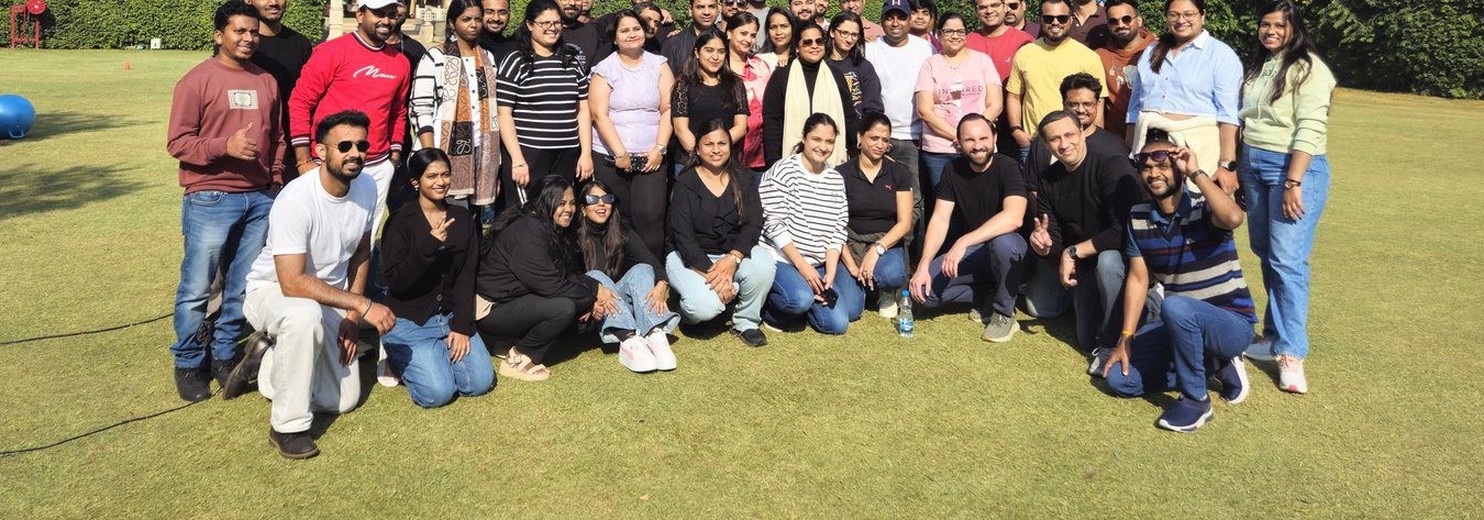 Corporate team outing group photo on lawn organised by Gotag