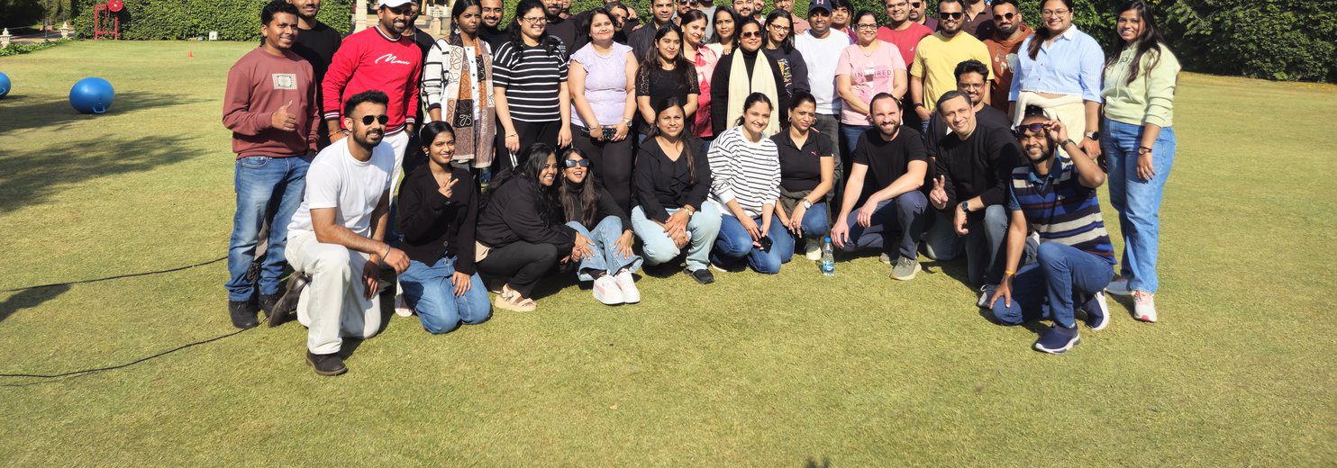 Corporate team outing group photo on lawn organised by Gotag